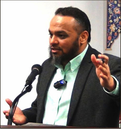 Hafiz Ikhlas Ansari speaking. Photo by Community Builders Chicago.